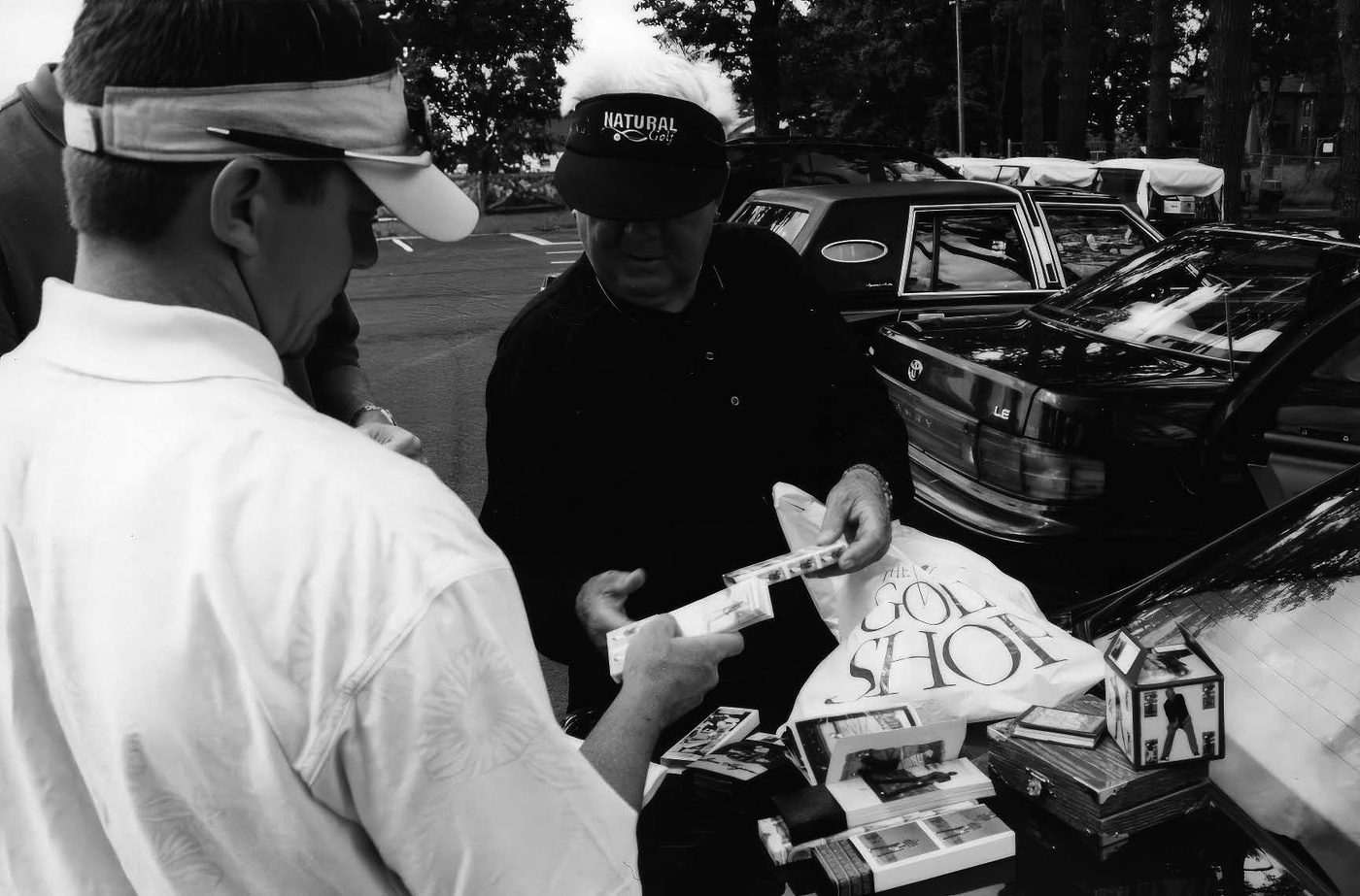 Todd Graves and Moe Norman discussing the treasured contents of his Cadillac.
